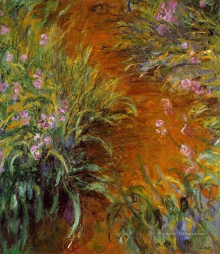  impressionniste art - Le chemin à travers les iris Claude Monet Fleurs impressionnistes